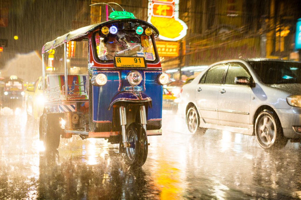 A tuk-tuk during a tropical rainstorm, Bangkok, Thailand